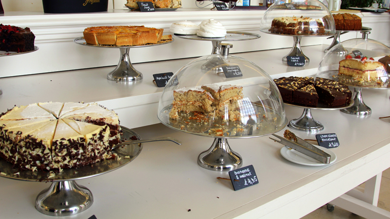 Trays and pedestals of cakes and sweets.